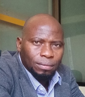 Professional portrait of Mr. Raymond Ndyamukama